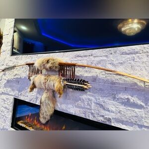 Hand made bow and arrow by enrolled member of the Cherokee tribe. 68”